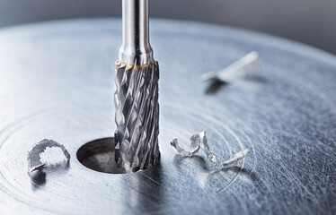 Milling cutter make sink in hole in steel billet. Locksmith work.