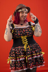 Woman wearing a dress and hat for a June party in fun poses