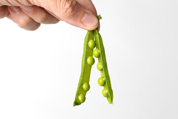 Fresh green peas isolated on a white background