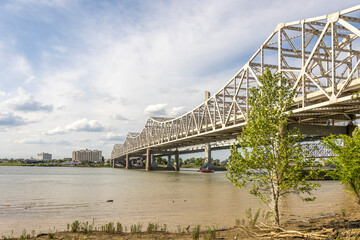 The Kennedy Memorial Interstate 65 Bridge in Louisville, Kentucky from the shore of the Ohio River. 