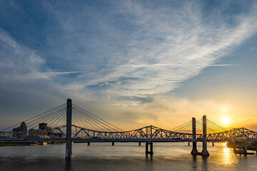 The Interstate 65 bridge over the Ohio River between Louisville, Kentucky and Jeffersonville, Indiana at sunset. 