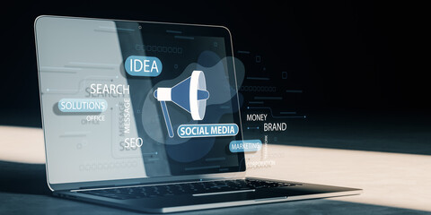 Close up of laptop with creative social media ad hologram with loud speaker and text on dark background with mock up place. SMM and marketing concept. 3D Rendering.