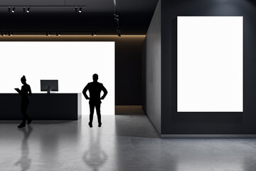 Businessmen standing in modern office interior with white reception desk and mock up banner.