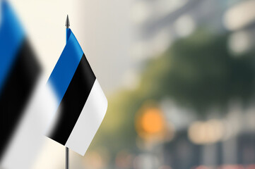 Small flags of Estonia on a blurred background