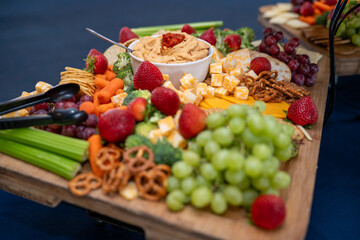 Graze Board. The board includes a variety of cheeses, fruits, vegetables, dips and crackers.