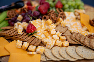 Graze Board. The board includes a variety of cheeses, fruits, vegetables, dips and crackers.