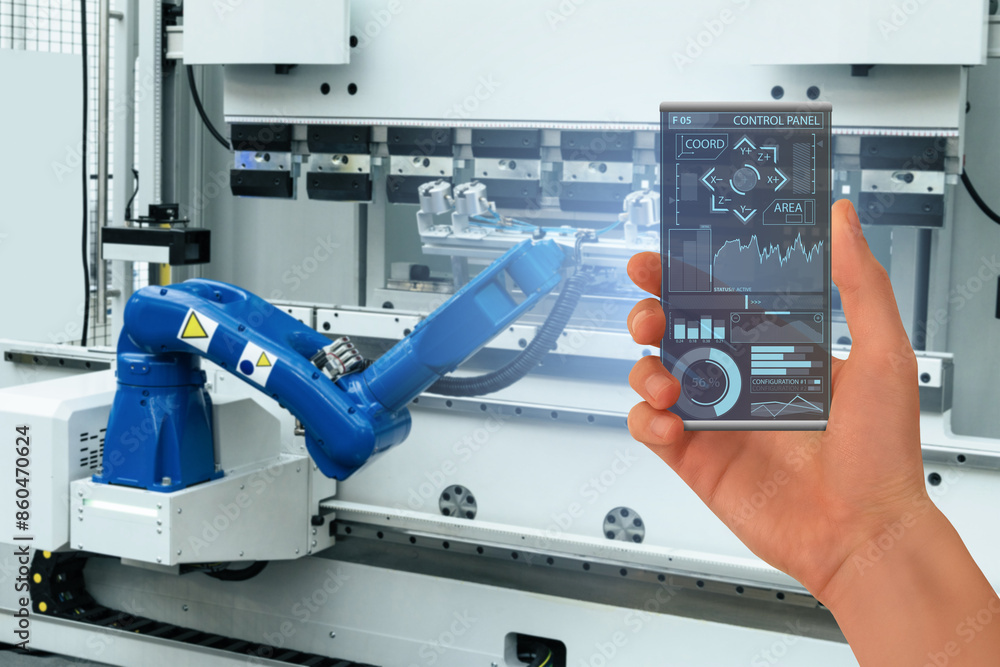 Poster Engineer uses a futuristic transparent smartphone to control robots in a smart factory. Smart industry 4.0 concept