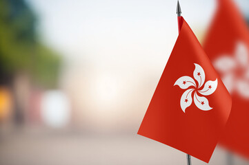 Small flags of Hong Kong on a blurred background