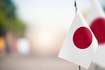 Small flags of Japan on a blurred background