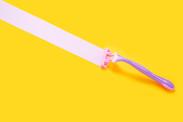 depilatory razors on a yellow background