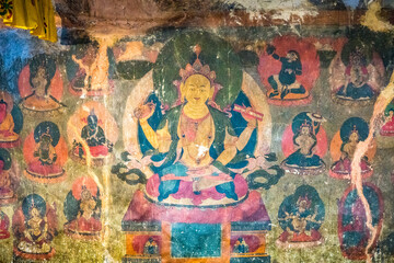 A detailed view of a vibrant Buddha painting displayed on a wall, Stongdae Monastery in Zanskar