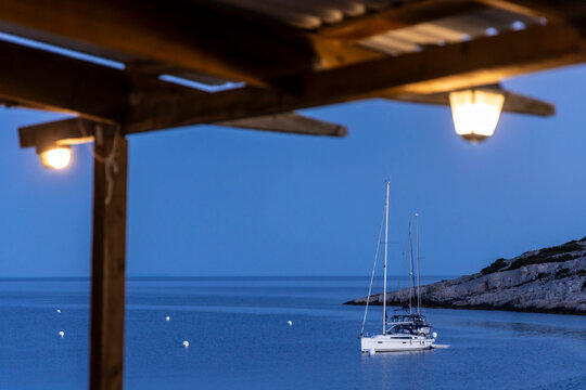 Sailing yacht at the buoy on Mediterranean coast of the island Zirje in Croatia