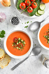Diet gazpacho soup in bowl over light background