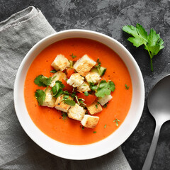 Tomato gazpacho soup with croutons in bowl