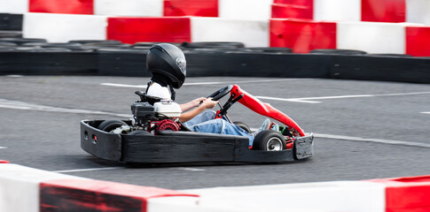 Kid Driving Fast Go Kart By Racing Track, Extreme Entertainment