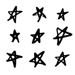 Set of black hand drawn vector stars in doodle style on white background. Star doodles are drawn with ink. Brush marker schematic