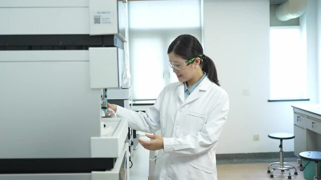 doctor examing bottle of reagent in lab