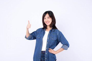 Asian woman wearing denim jean is posing with thumbs up gesture on a white background.