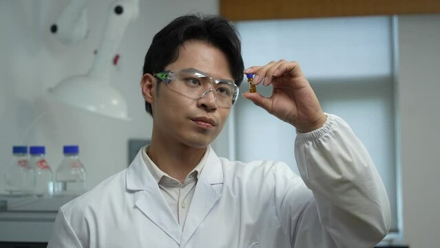 man doctor examing reagent in lab