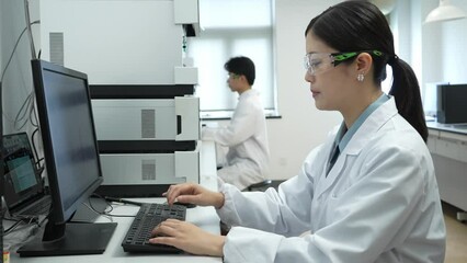 doctor working on computer in lab