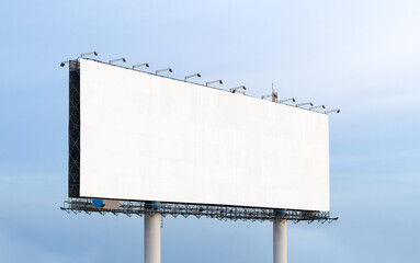 extra large Outdoor billboard with white background mock up. on clouds and blue sky background. Copy space for advertisement.