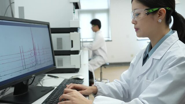 doctor working on computer in lab