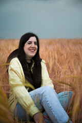 Young woman enjoying a sunny day on the meadow