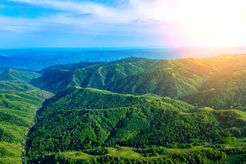 Drone view on forested mountain peaks, beautiful valleys, wildlife of Kazakhastan