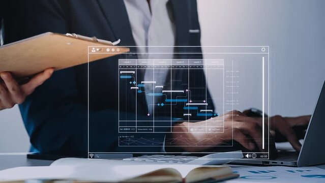 Project manager working with Gantt chart schedule to plan tasks and deliverables. Scheduling activities with a planning software, Corporate strategy for finance, operations, sales, marketing.