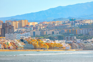 Las Palmas cityscape with beach and mountains in Gran Canaria, Canary Islands. City view featuring...