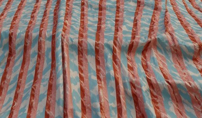 Colorful wavy striped pattern with blue and red hues.