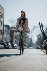 Active young adult enjoying a bike ride in the city, exuding happiness and vitality on a bright day.