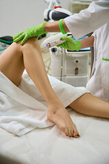 Doctor performs a vaginal wall rejuvenation procedure on a patient
