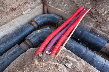 Laying new large diameter water pipes in the ground in the city.