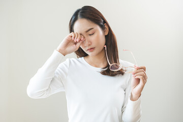 Eye problem concept, fatigue asian young woman tired eyes irritated rubbing, massage eye dry relief...
