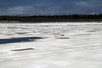 Spring flood, river with remnants of ice, melting ice, landscape river ice spring, thawed dangerous...
