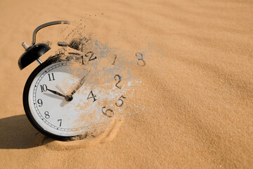 Alarm clock dissolving among desert. Time is running out