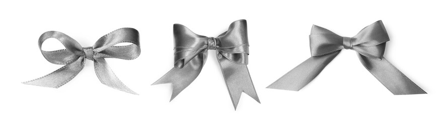 Beautiful silver bows isolated on white, set