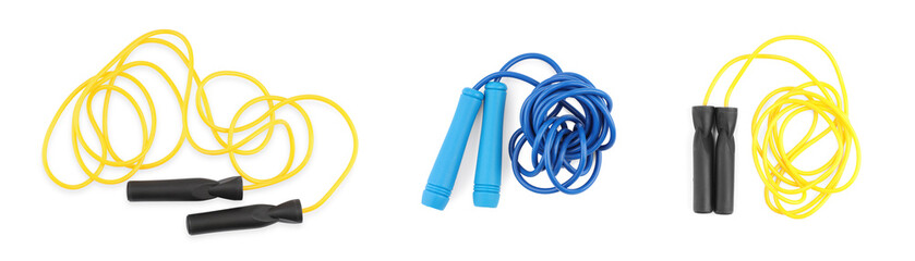 Different skipping ropes on white background, set. Sport equipment
