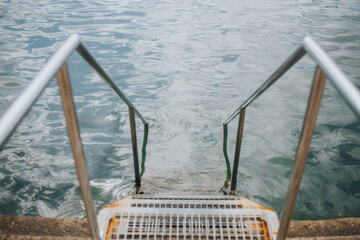 stainless steel steps leading to sea