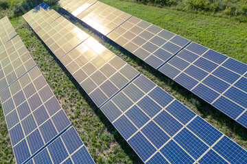 aerial view of solar panels on solar farm during a sunny day. modern photovoltaic solar battery...
