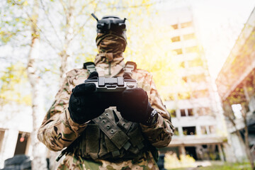 UAV Army operator in FPV glasses controls drone with bomb to drop into enemy fortifications and...