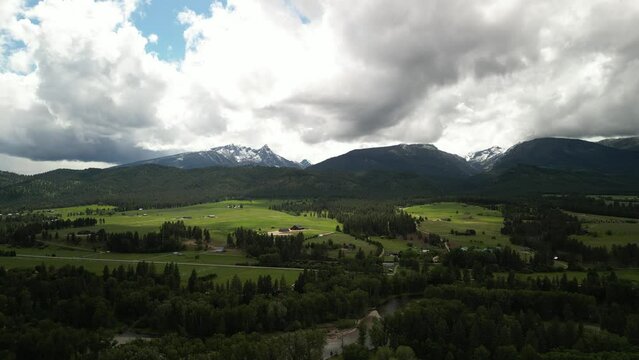 Aerial of Bitterroot mountains near Missoula Montana in summer with dramatic sky