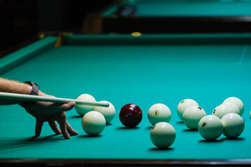 Sports game of billiards on a green cloth