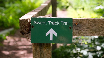 Close up of sign for Sweet Track Trail within Shapwick Heath nature reserve on the Somerset Levels in England UK