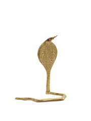 a souvenir model of a cobra snake made of brass metal with carvings isolated