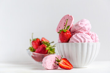 pink strawberry marshmallows in a beautiful white plate on a white background