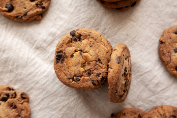 Homemade Gooey Chocolate Chip Cookies on a white wooden background, top view.