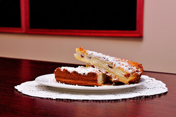 Sweet pie slices in cake cafe on blackboard menu background. Pastry cake cafe products close up. Delicious pie menu in restaurant. Fresh baked cake cheese pie slice on cafe lunch. Desserts shop menu