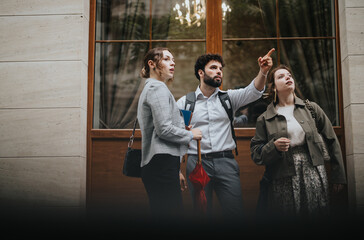 Young business professionals brainstorming ideas and discussing strategy outside an urban office building, showcasing teamwork, collaboration, and networking.